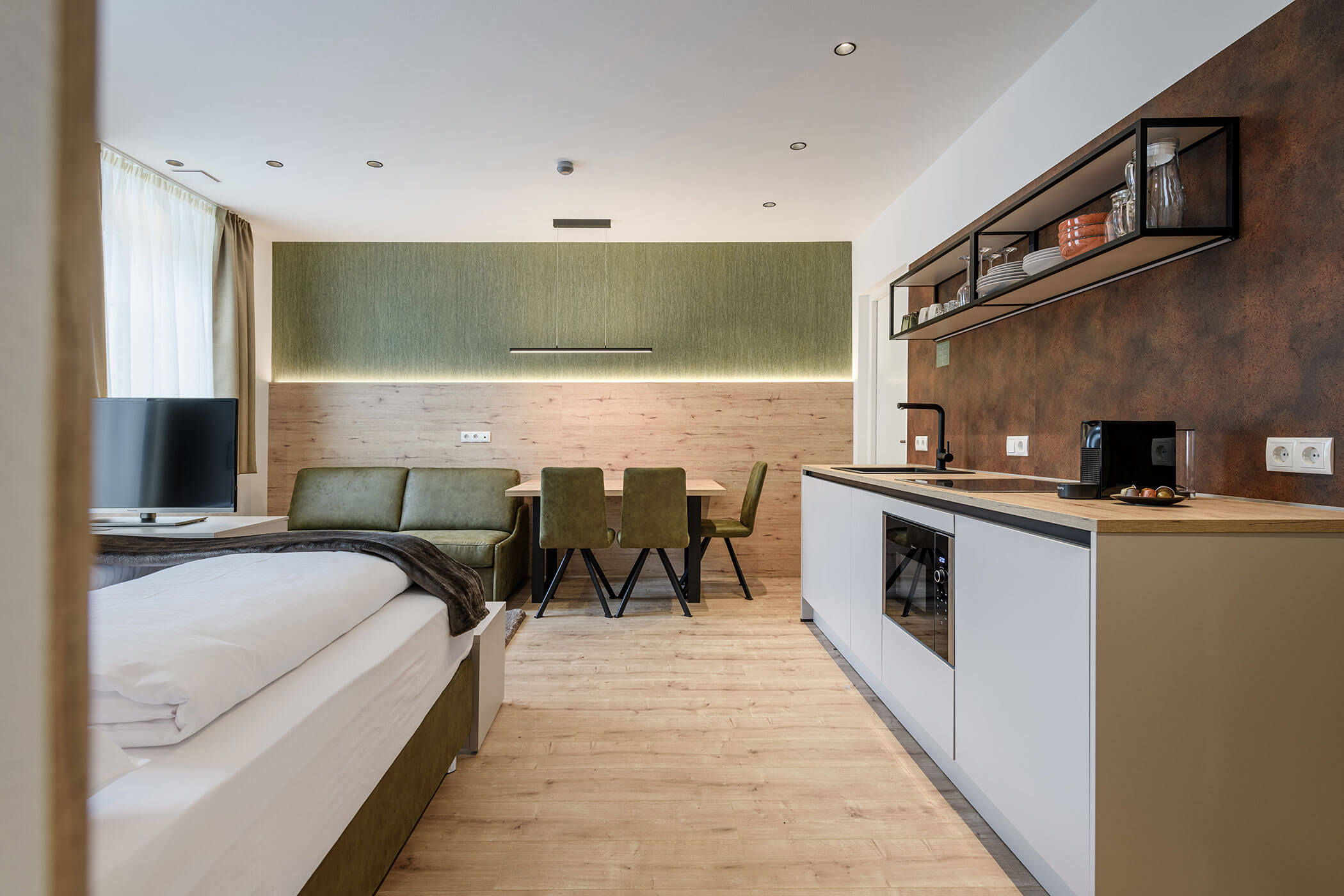 Soggiorno e camera da letto nell'Appartamento Emma di Villa Fauster